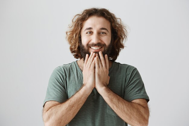 Happy pleased middle-eastern man looking with gratitude