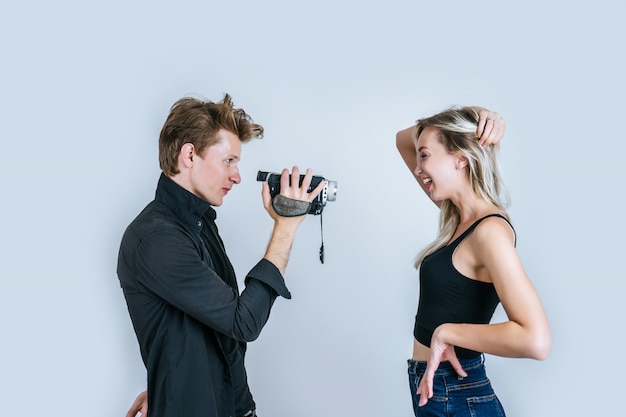 Happy portrait of Couple holding Video camera and Record clip video