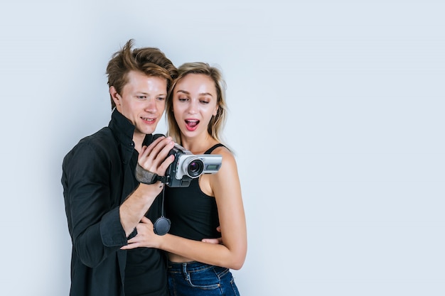 Happy portrait of Couple holding Video camera and Record clip video