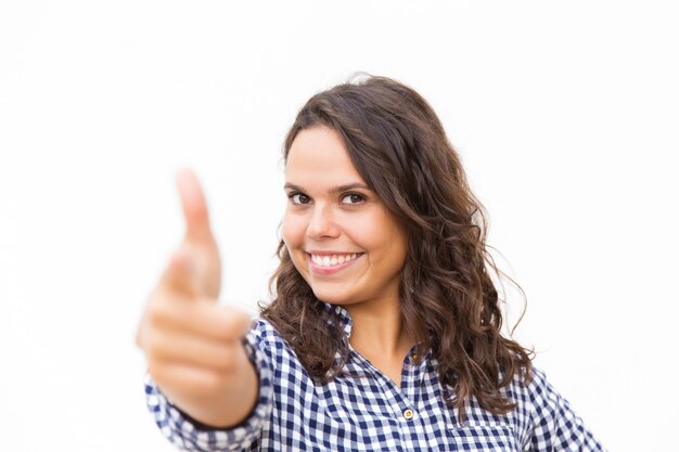 Happy positive woman pointing finger