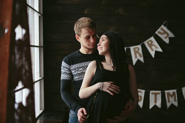 happy pregnant couple at home