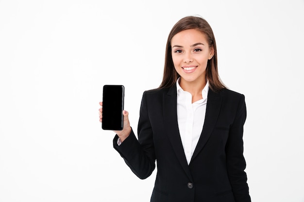 Happy pretty businesswoman showing display of mobile phone