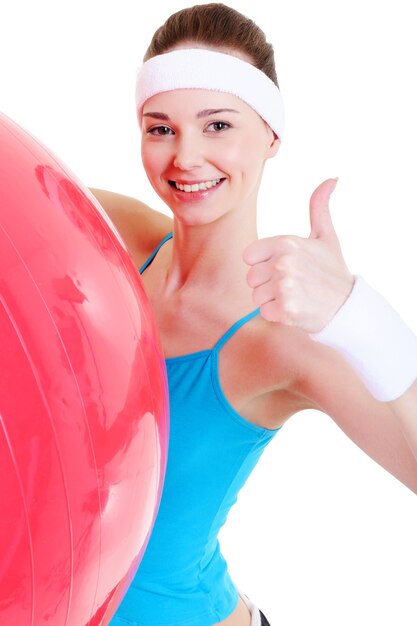 Happy pretty young girl with big fitball - close-up