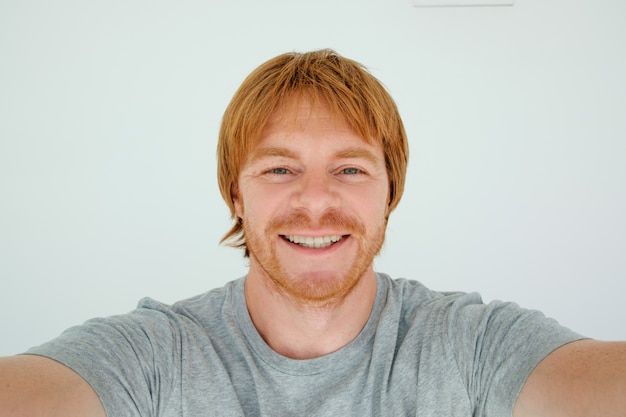 Happy Red-haired Man Taking Selfie Photo