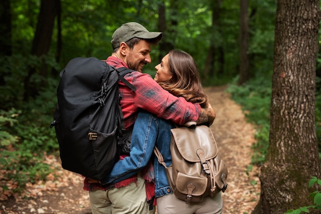 Free photo happy and romantic couple traveling together in nature