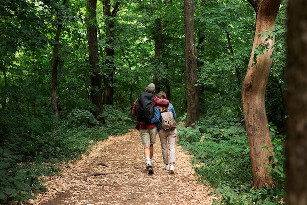 Happy and romantic couple traveling together in nature