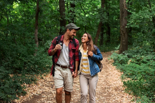 Happy and romantic couple traveling together in nature