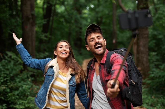 Happy and romantic couple traveling together in nature