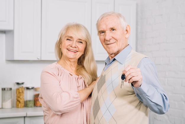 Happy senior couple in kitchen