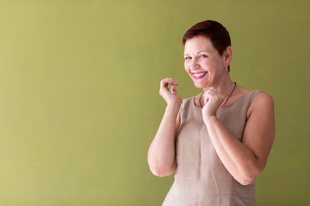 Happy senior woman laughing