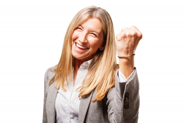 Happy senior woman with a fist high