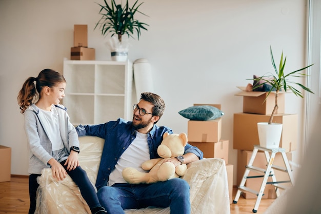 Happy single father with daughter moving into a new home