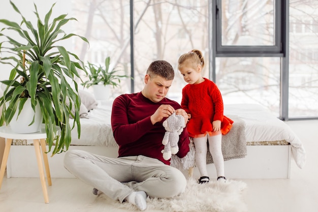 Happy small kid girl enjoying sweet moment with dad