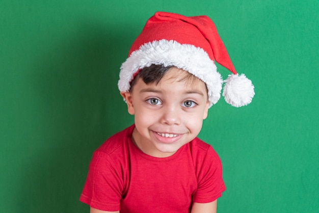 Happy and smiling boy with christmas hat