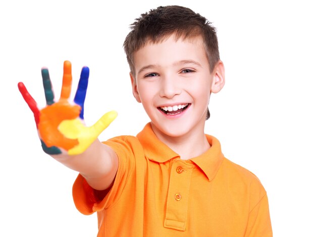 Happy smiling boy with a painted hand isolated on white.