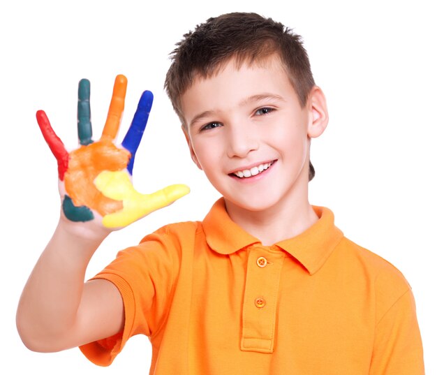 Happy smiling boy with a painted hand - isolated on white.