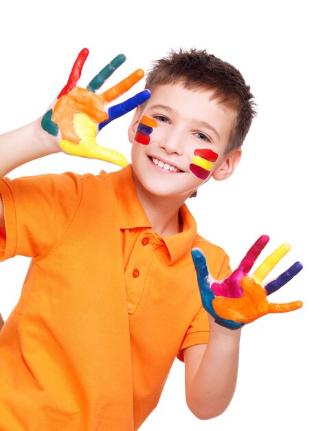 Happy smiling boy with a painted hands and face in orange t-shirt on white.