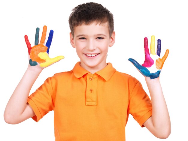 Happy smiling boy with a painted hands isolated on white.