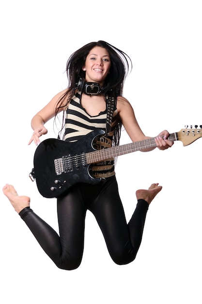 Happy smiling girl playing guitar