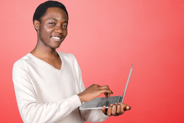 Happy smiling handsome man with laptop