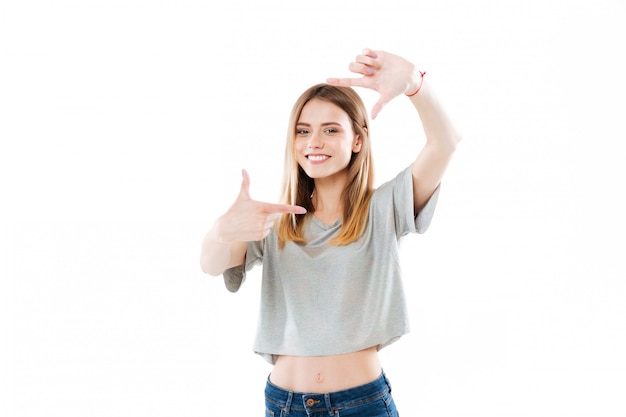 Happy smiling woman framing her face with her hands