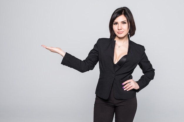 Happy smiling young beautiful Businesswoman showing blank area for sign or copyspase, isolated on white