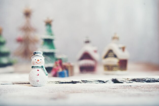 Happy snowman with unfocused background