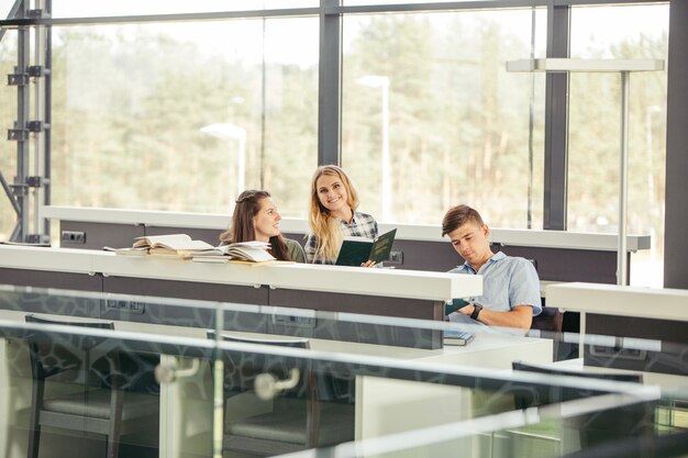 Happy students in library