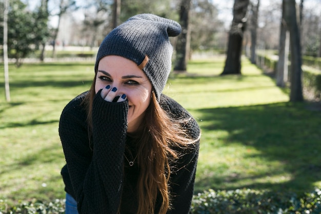 Happy stylish girl laughing at camera