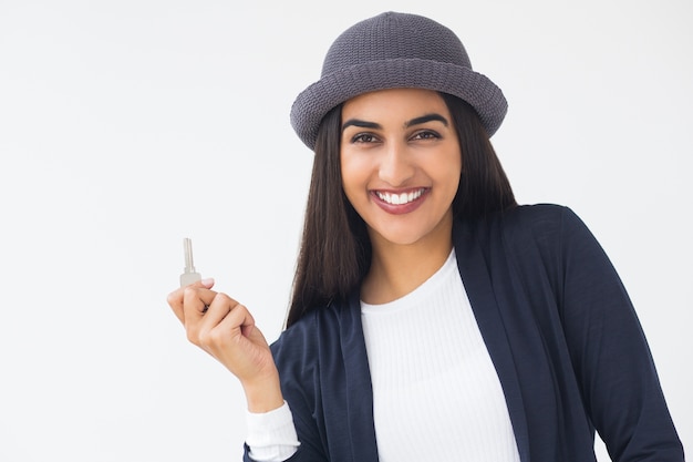 Happy Stylish Young Indian Woman Showing Key