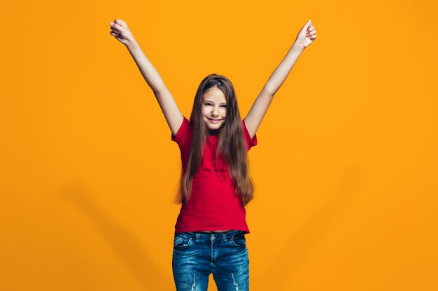 Happy success teen girl celebrating being a winner