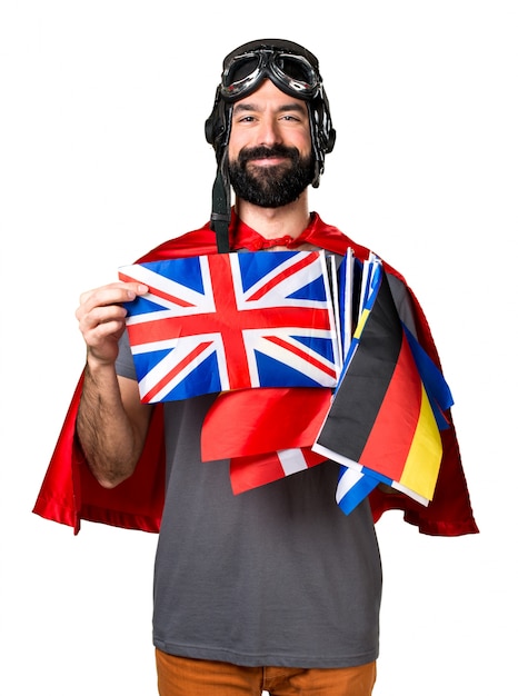 Free photo happy superhero with a lot of flags