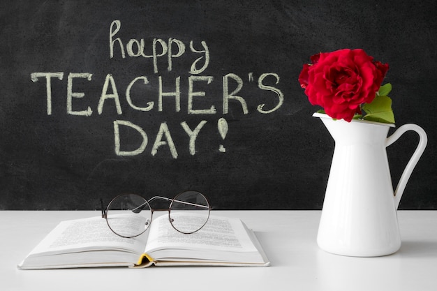 Happy teacher's day with flowers and book