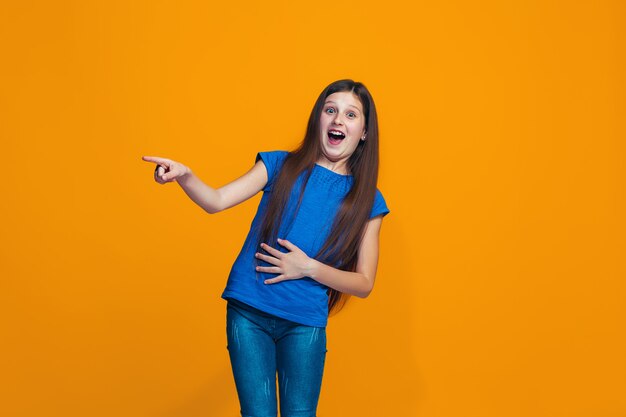 The happy teen girl standing and smiling