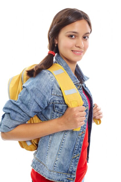 Happy teenager carrying a yellow backpack