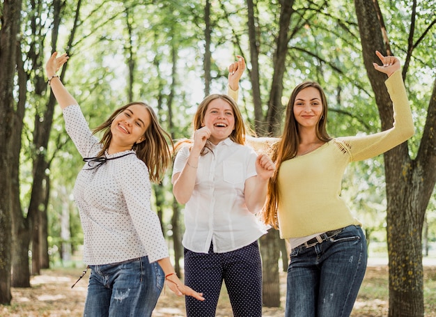 Happy teenager girls posing for camera