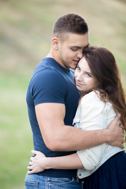 Happy teenager hugging her boyfriend