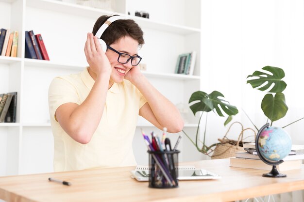 Happy teenager listening to music