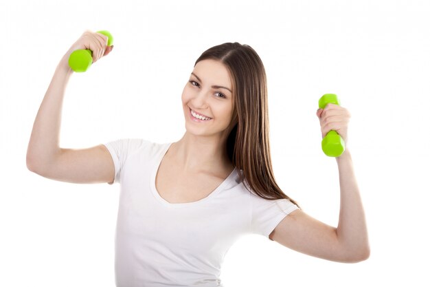 Happy teenager working out with weights