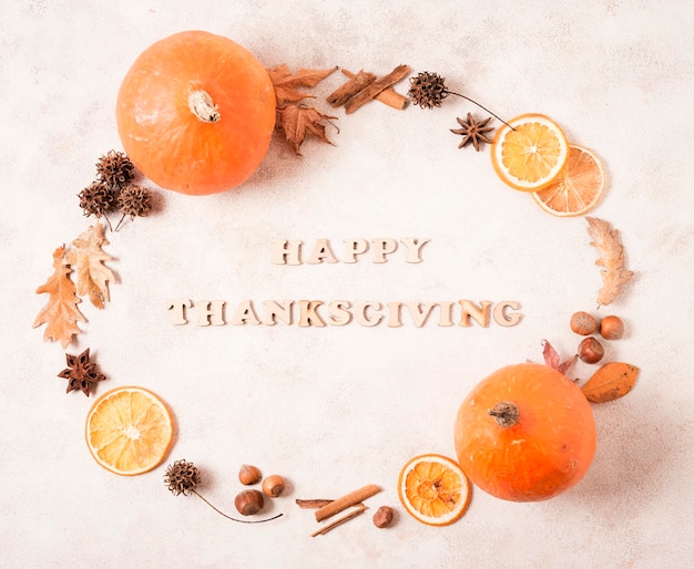 Happy thanksgiving frame with citrus and leaves