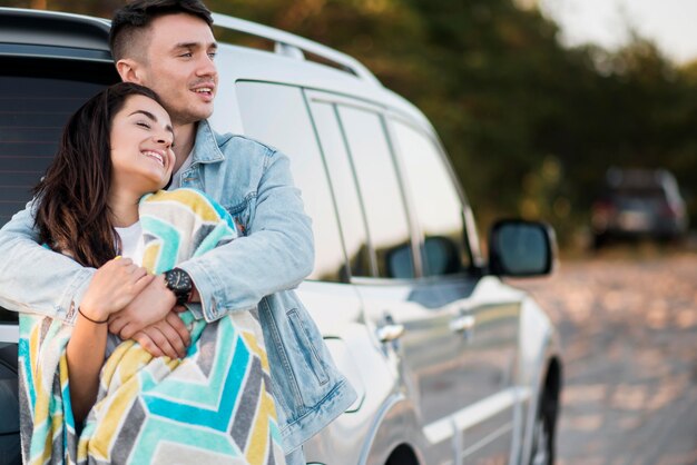 Happy tourist couple on a road trip