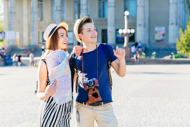 Happy tourist couple visiting city