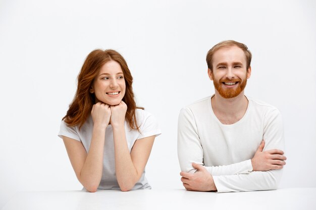 Happy two redhead, man and woman smiling