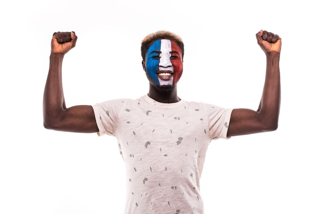 Happy victory scream afro fan support France national team with painted face isolated on white background