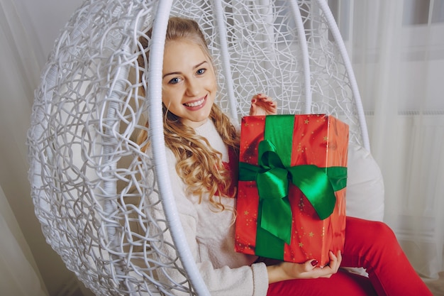 happy window sweater red chair