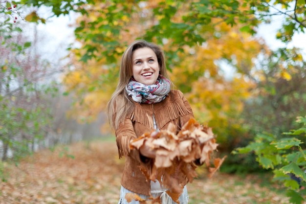 Free photo happy woman in autumn park