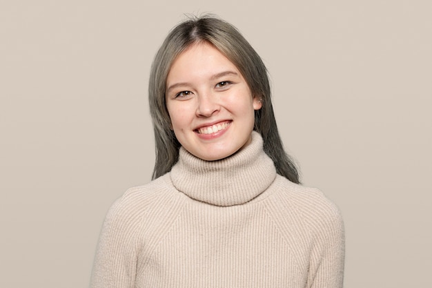 Happy woman in a beige sweater