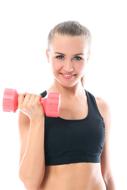 Happy woman doing exercises with dumbbells