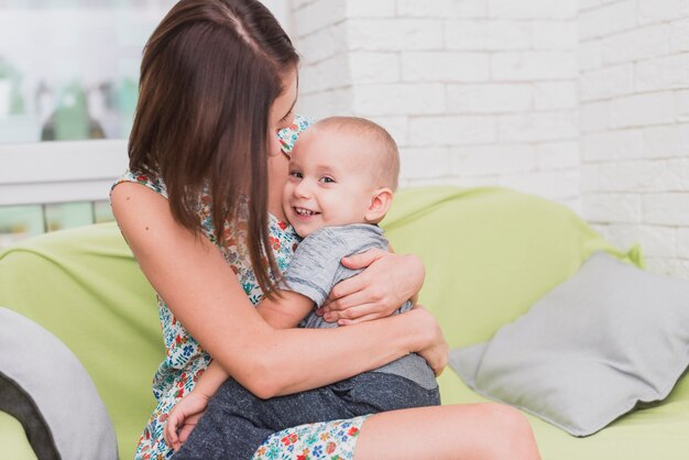 Happy woman embracing her son