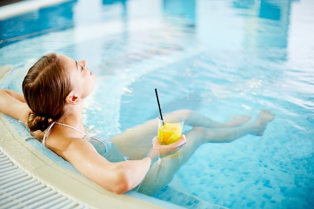 Happy woman enjoying bath